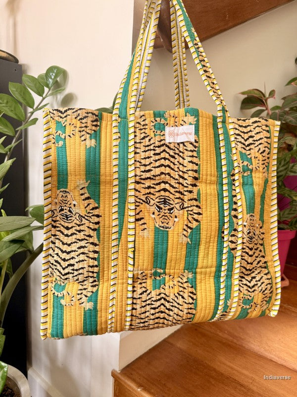 Tote bag with tiger print hanging from a wooden beam