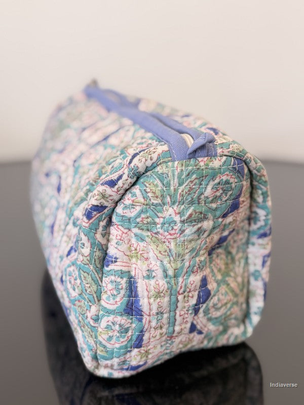 Patterned fabric pouch on a gray surface