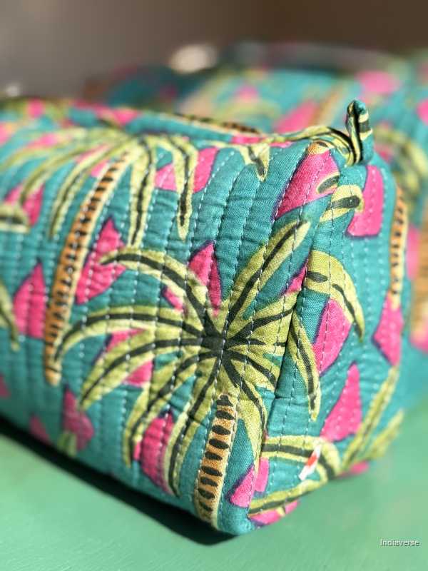 Colorful fabric pouch with palm tree pattern on a green surface | Tropical Bliss