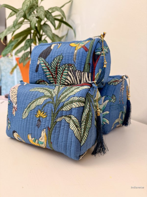 blue pouches with animal jungle print sitting on a white surface | Tropical Jungle