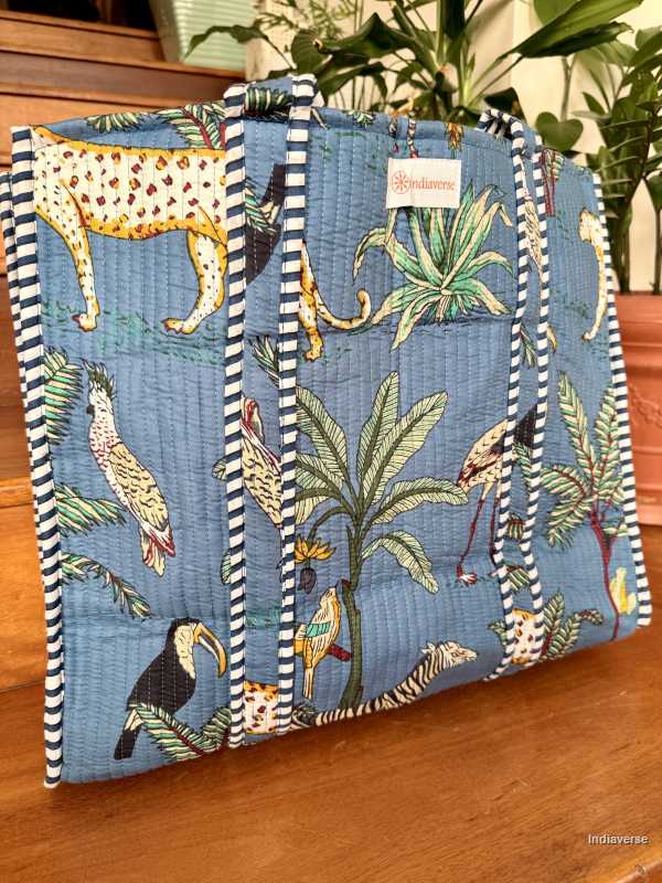 Tote bag with tropical animal pattern on a wooden surface