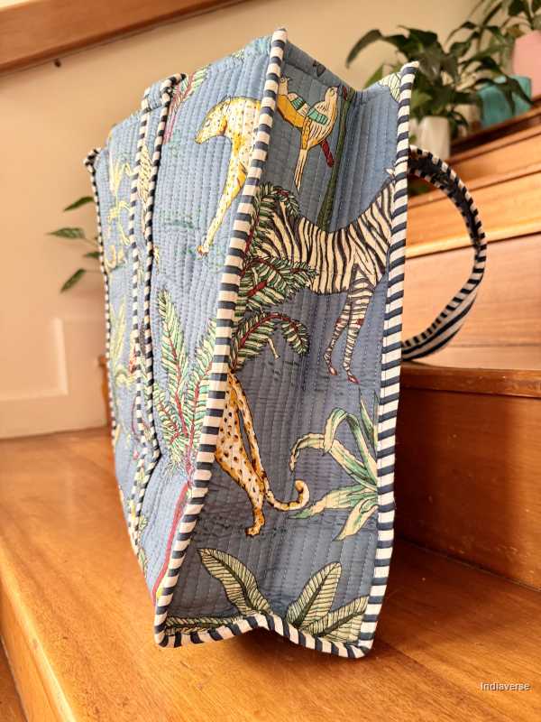 Decorative bag with animal prints on a wooden surface