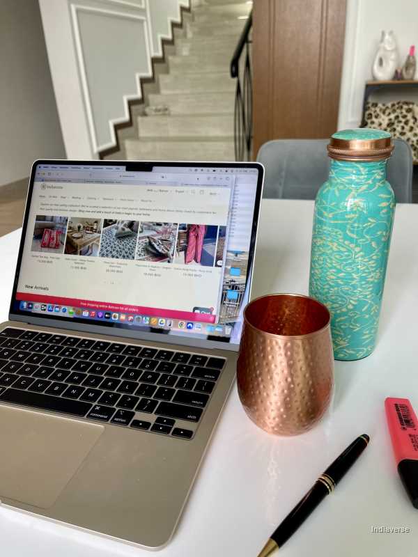 Turquoise color enameled copper bottle with ethnic design for storing drinking water with a capacity up to 600 ml