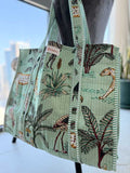 Tote bag with animal and plant pattern on a mannequin